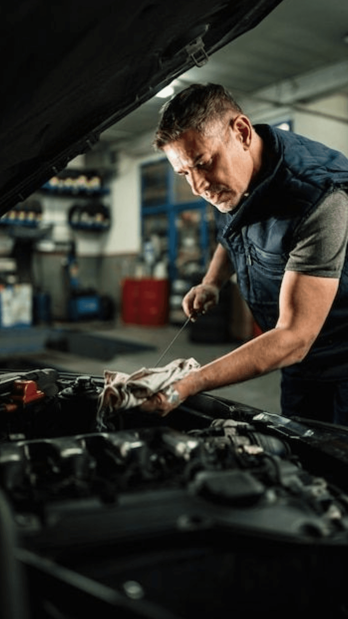 EC Vehicle Repairs mechanic working on engine